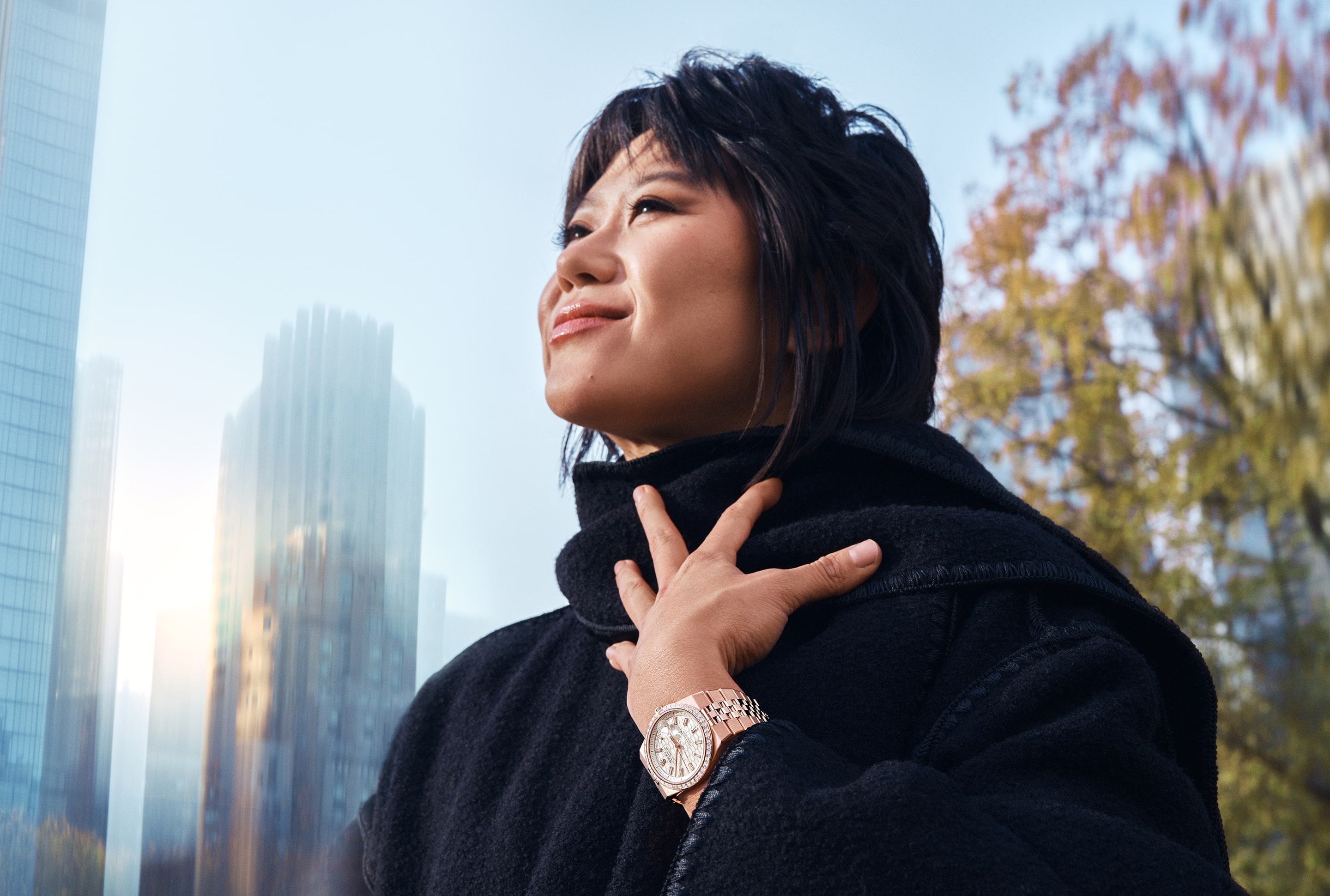 Image of Woman wearing a Rolex Land-Dweller watch