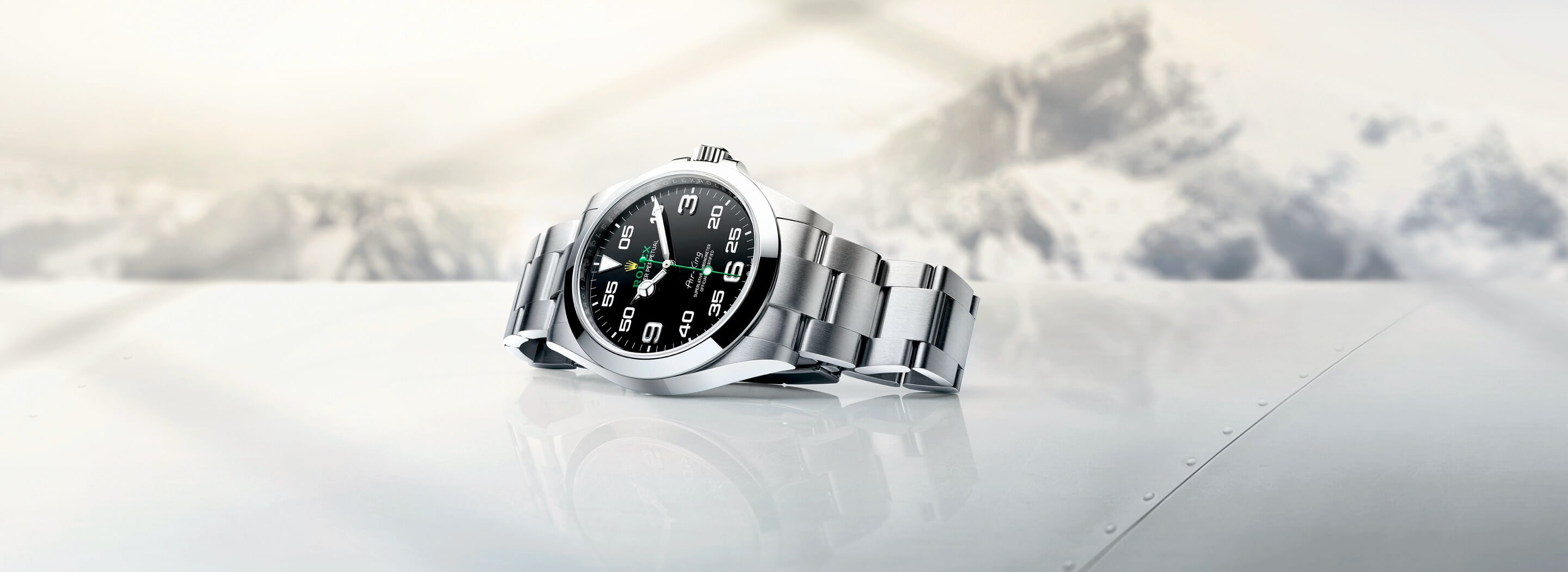 Rolex Airking sitting on its side on a plane wing
