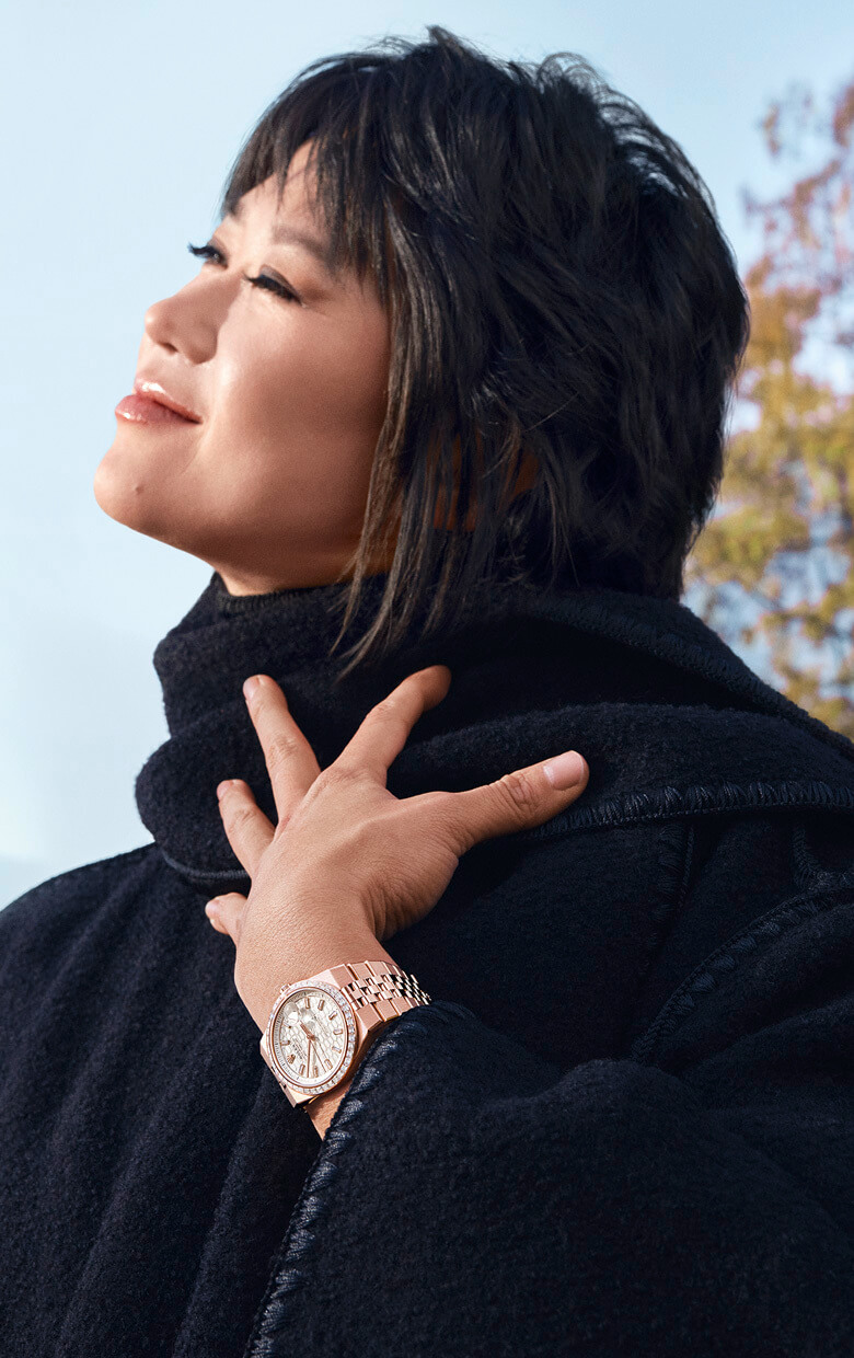 Woman wearing a Rolex Land-Dweller watch