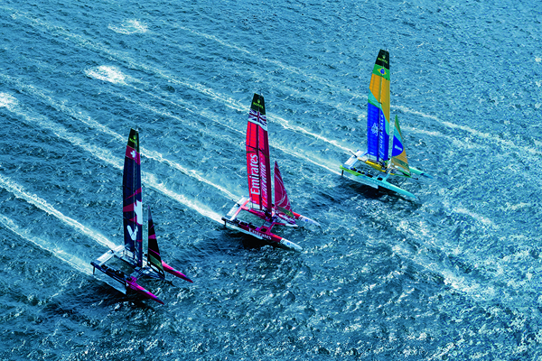 Article cover with three sailboats in water