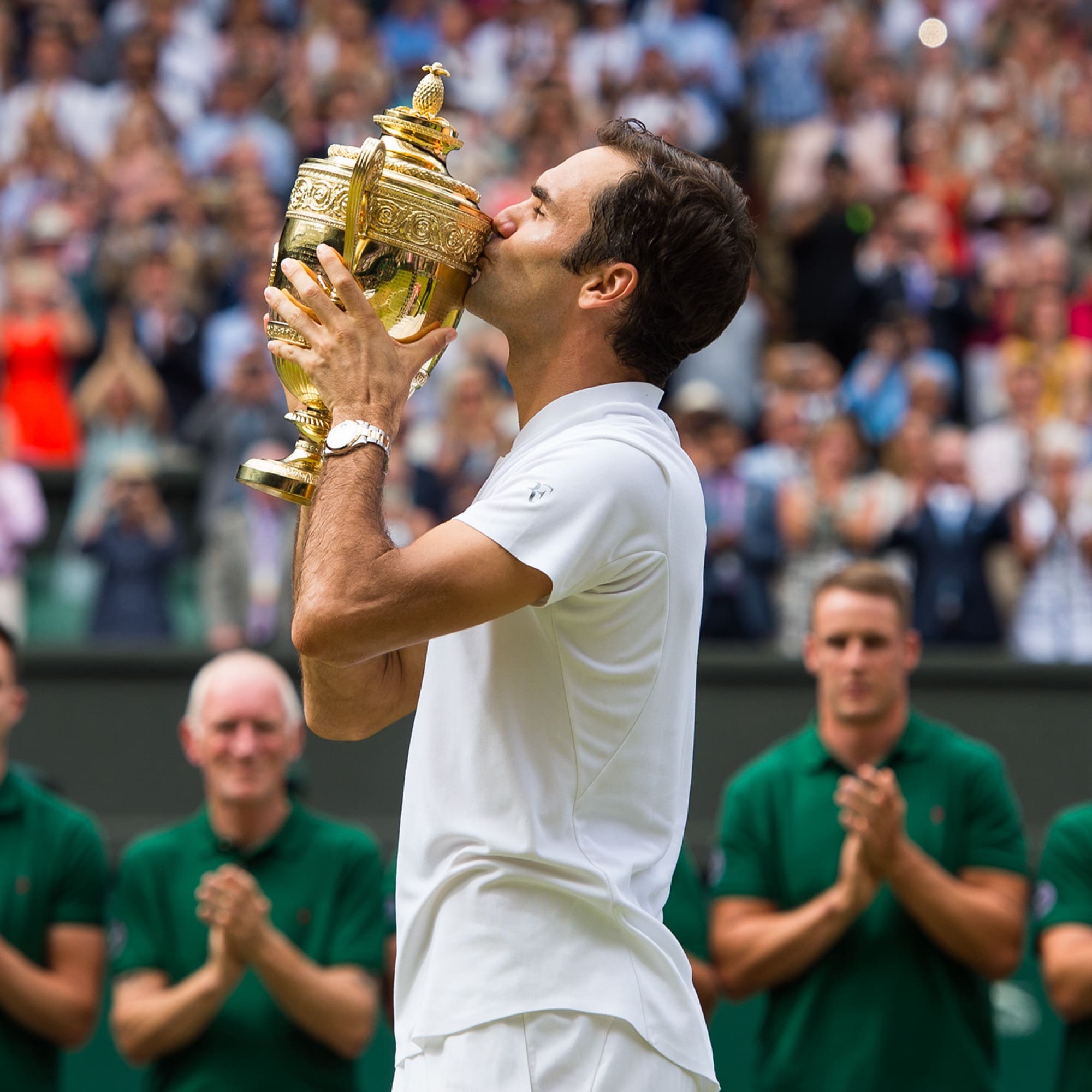 Image of man kissing trophy